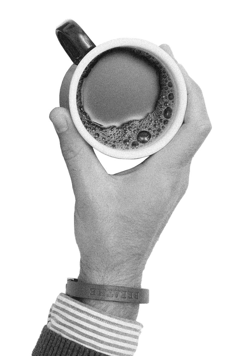 Hand holding a coffee